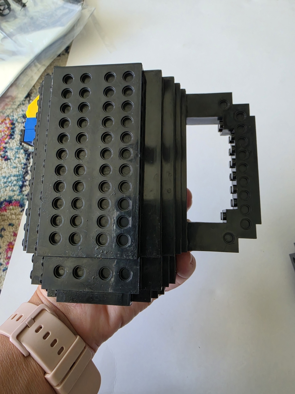 Black, build-on brick mug, a novelty coffee cup compatible with Legos